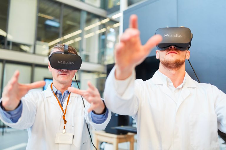 Employees at a company trying out VR headsets