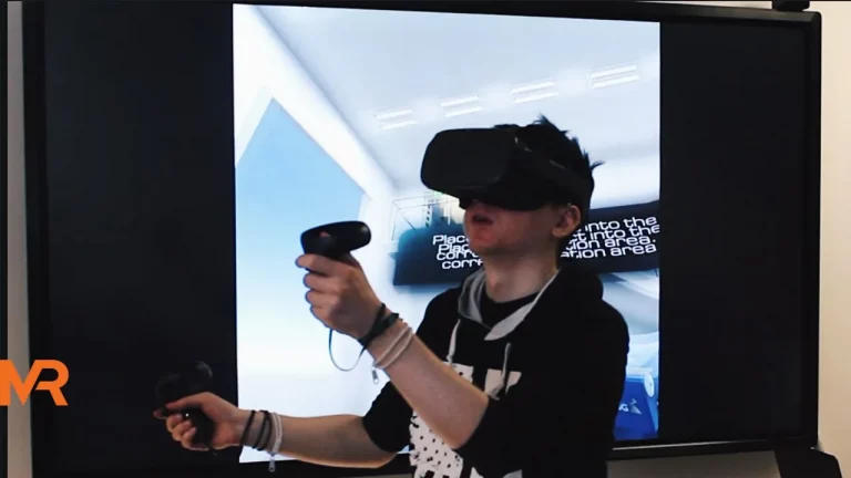 A guy playing with a VR educational application